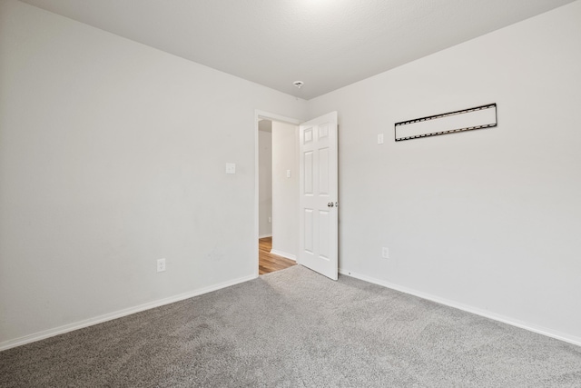 6096 Saddle Hill Dr, Alexander, AR 72002 - spare room with light colored carpet and baseboards