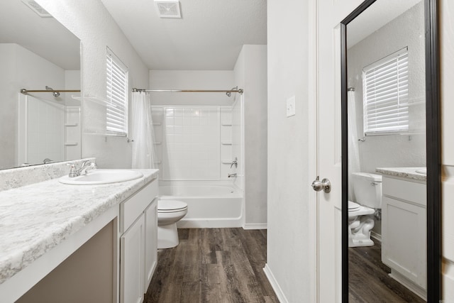 6096 Saddle Hill Dr, Alexander, AR 72002 - bathroom featuring toilet, vanity, wood finished floors, and shower / bath combo with shower curtain