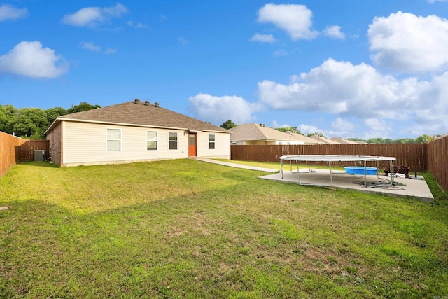 6096 Saddle Hill Dr, Alexander, AR 72002 - rear view of house with a trampoline, central AC unit, and a patio area