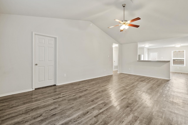 6096 Saddle Hill Dr, Alexander, AR 72002 - unfurnished living room with lofted ceiling, a ceiling fan, wood finished floors, and baseboards