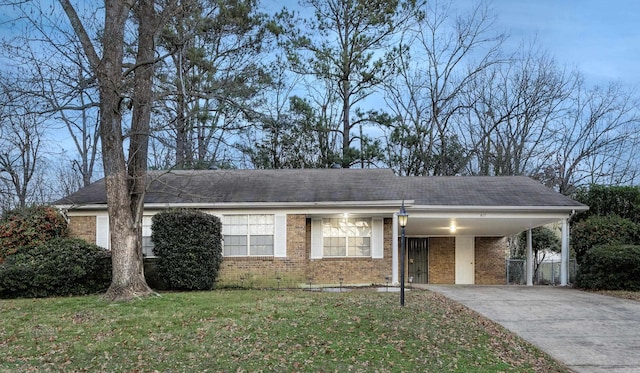 817 Ouachita Pl, Little Rock, AR 72205 - single story home featuring brick siding, an attached carport, driveway, a front yard, and roof with shingles