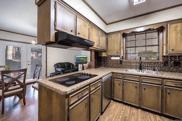 817 Ouachita Pl, Little Rock, AR 72205 - kitchen with a textured ceiling, black electric cooktop, a sink, under cabinet range hood, and dishwasher