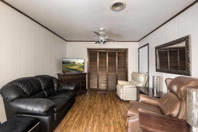 817 Ouachita Pl, Little Rock, AR 72205 - living area with crown molding, dark wood-type flooring, a ceiling fan, and a textured ceiling