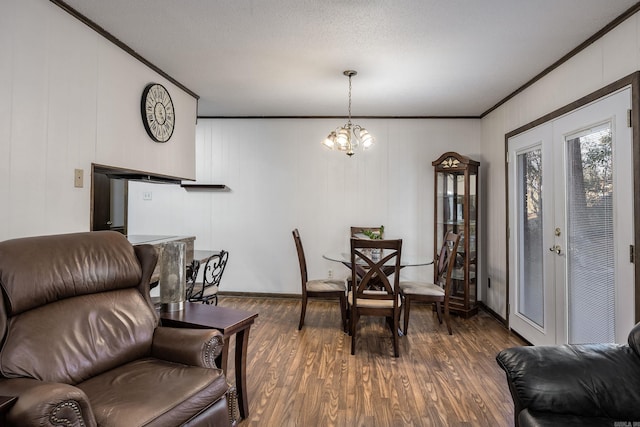 817 Ouachita Pl, Little Rock, AR 72205 - dining room with crown molding, dark wood-type flooring, and a chandelier