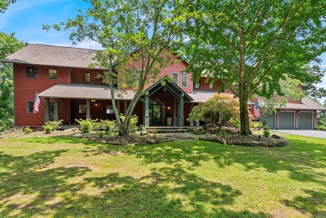 4501 Ridgefield Ln, Little Rock, AR 72223 - view of front of home with covered porch, a front yard, and a shingled roof
