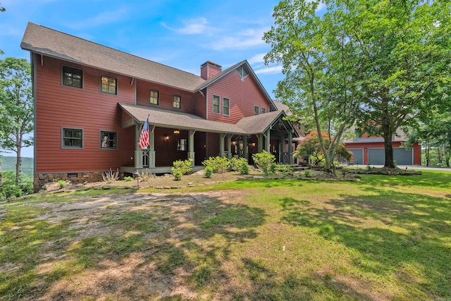 4501 Ridgefield Ln, Little Rock, AR 72223 - back of house with a yard, a chimney, and covered porch