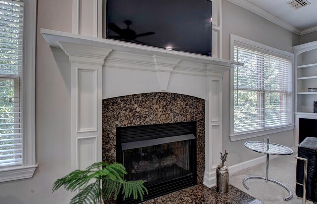 9 Lanes End, Little Rock, AR 72223 - detailed view of a fireplace, carpet, a ceiling fan, crown molding, and baseboards