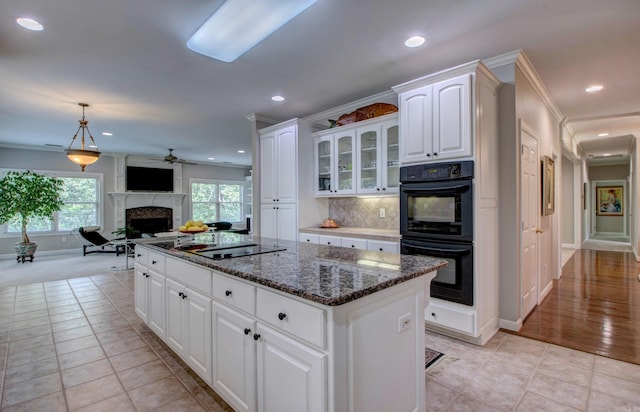 9 Lanes End, Little Rock, AR 72223 - kitchen with black appliances, ceiling fan, a center island, ornamental molding, and baseboards