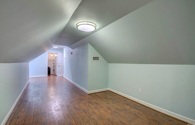 9 Lanes End, Little Rock, AR 72223 - additional living space with dark wood-style flooring, vaulted ceiling, and baseboards