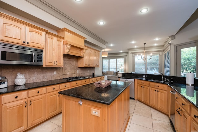 22 Epernay Cir, Little Rock, AR 72223 - kitchen with appliances with stainless steel finishes, a sink, ornamental molding, a center island, and light tile patterned floors