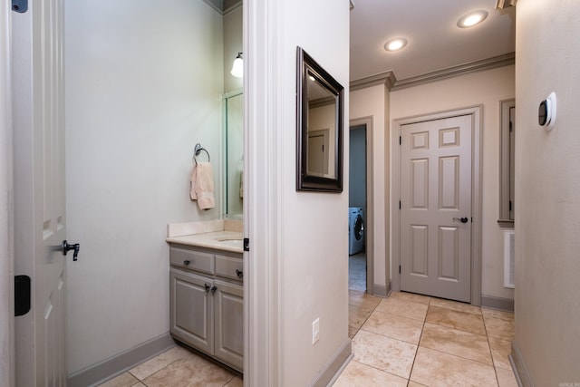 22 Epernay Cir, Little Rock, AR 72223 - bathroom featuring washer / clothes dryer, vanity, baseboards, tile patterned flooring, and recessed lighting