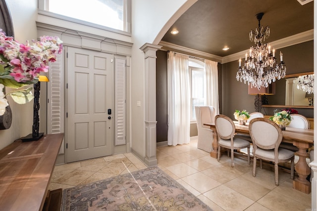 22 Epernay Cir, Little Rock, AR 72223 - entryway featuring arched walkways, crown molding, a chandelier, decorative columns, and baseboards