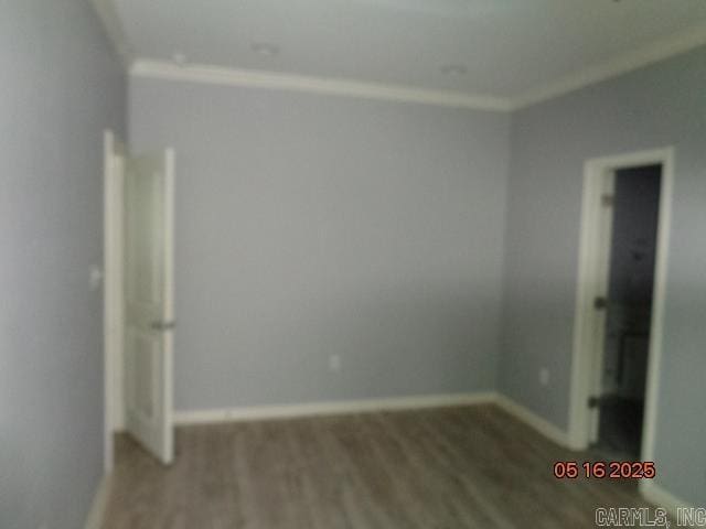 3122 Main St, Little Rock, AR 72206 - unfurnished bedroom featuring crown molding, wood finished floors, and baseboards