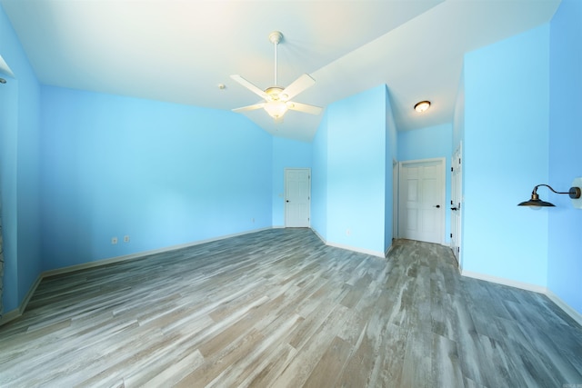 505 E Tri Lks, Horseshoe Bend, AR 72512 - unfurnished room with wood finished floors, a ceiling fan, baseboards, and vaulted ceiling