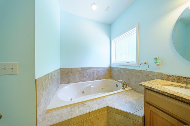 505 E Tri Lks, Horseshoe Bend, AR 72512 - bathroom featuring vanity and a jetted tub