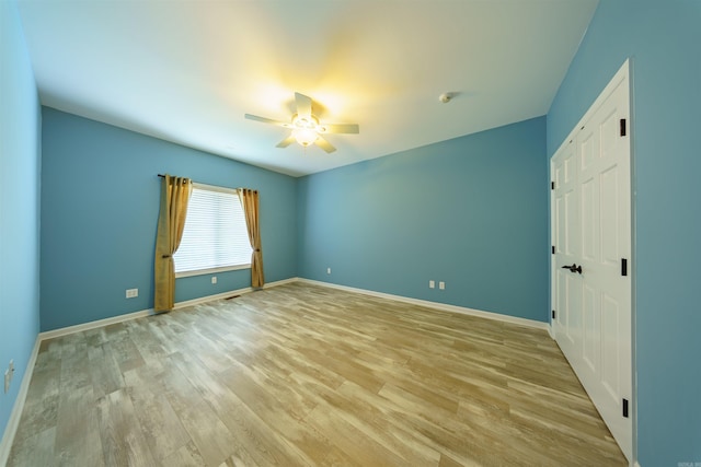 505 E Tri Lks, Horseshoe Bend, AR 72512 - spare room with a ceiling fan, light wood-type flooring, and baseboards