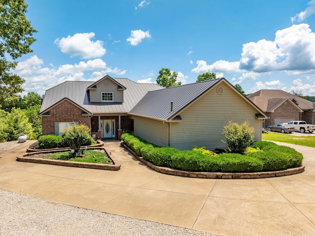 505 E Tri Lks, Horseshoe Bend, AR 72512 - traditional-style home featuring brick siding and metal roof