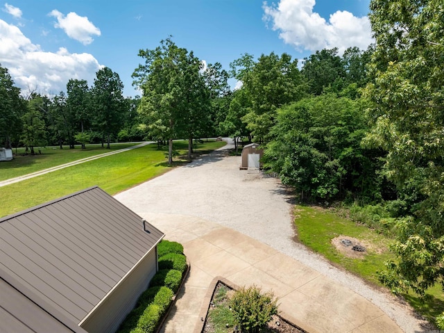 505 E Tri Lks, Horseshoe Bend, AR 72512 - surrounding community featuring a lawn and driveway