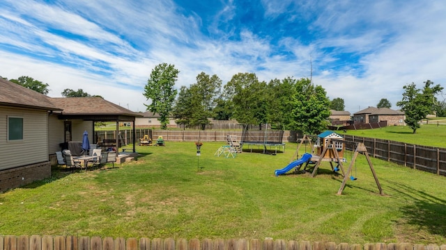 390 Bobwhite Cir, Lonoke, AR 72086 - view of yard with a trampoline and a playground