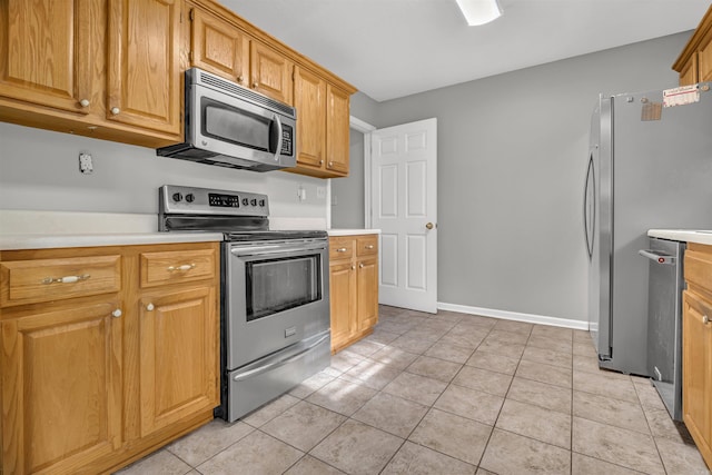 57 Deerfield Dr, Plumerville, AR 72127 - kitchen featuring stainless steel appliances, light countertops, and light tile patterned floors