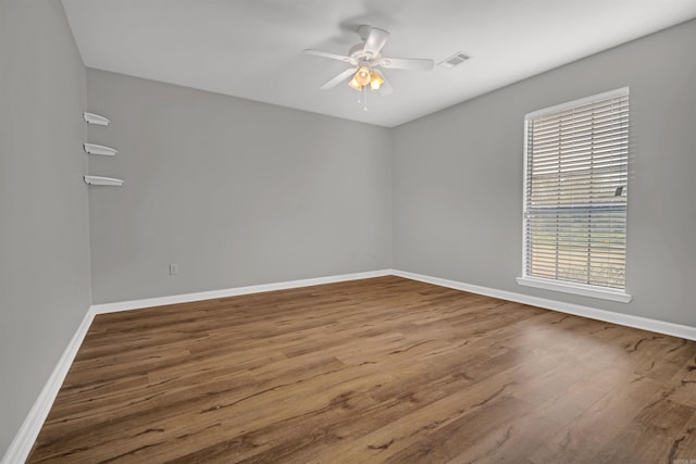 57 Deerfield Dr, Plumerville, AR 72127 - empty room with wood finished floors and a ceiling fan