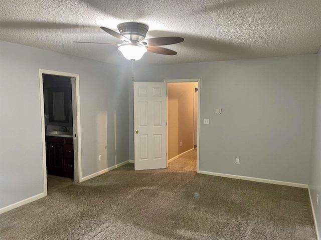 417 Ridge Rd, Pocahontas, AR 72455 - unfurnished bedroom with carpet floors, a sink, a textured ceiling, connected bathroom, and baseboards