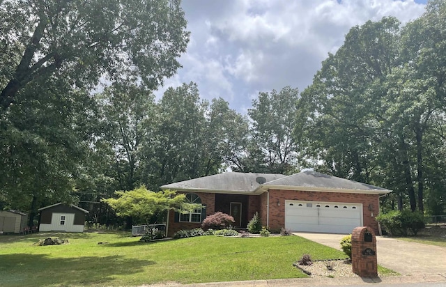 417 Ridge Rd, Pocahontas, AR 72455 - ranch-style house featuring a garage, a front yard, driveway, and brick siding