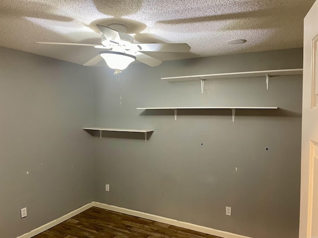 417 Ridge Rd, Pocahontas, AR 72455 - laundry room with dark wood-style flooring, a textured ceiling, baseboards, and ceiling fan