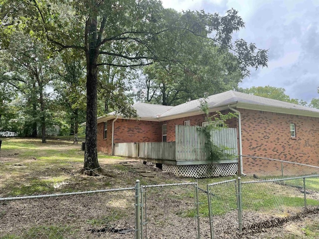 417 Ridge Rd, Pocahontas, AR 72455 - view of side of property featuring brick siding and a gate