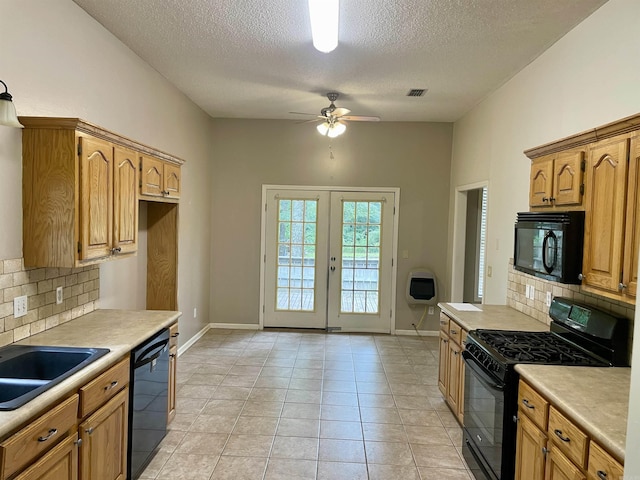 417 Ridge Rd, Pocahontas, AR 72455 - kitchen with black appliances, backsplash, a textured ceiling, and light countertops