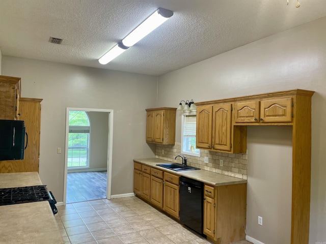 417 Ridge Rd, Pocahontas, AR 72455 - kitchen featuring black appliances, a sink, decorative backsplash, light countertops, and healthy amount of natural light
