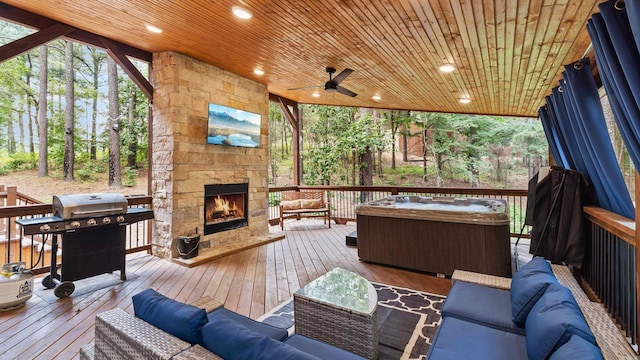 136 Gnarly Maple Trl, Hochatown, OK 74728 - wooden terrace with an outdoor living space with a fireplace, grilling area, and a ceiling fan