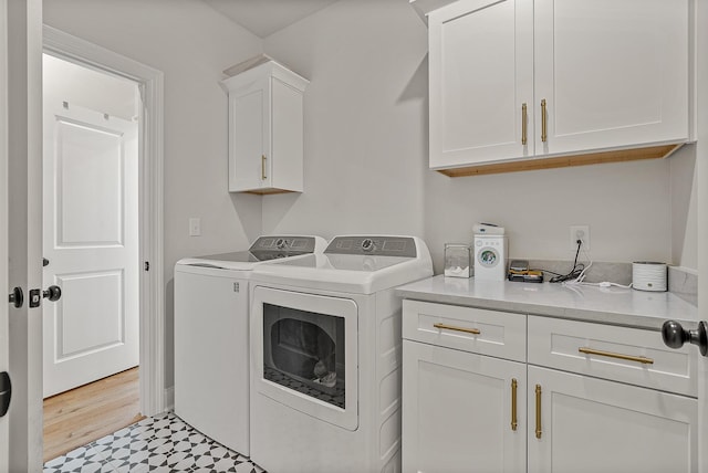 107 Hidden Creek Dr, Brookland, AR 72417 - washroom with cabinet space, washer and dryer, and light floors