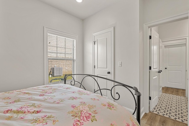 107 Hidden Creek Dr, Brookland, AR 72417 - bedroom with wood finished floors and recessed lighting