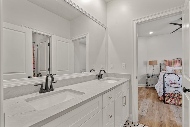 107 Hidden Creek Dr, Brookland, AR 72417 - full bathroom featuring double vanity and wood finished floors