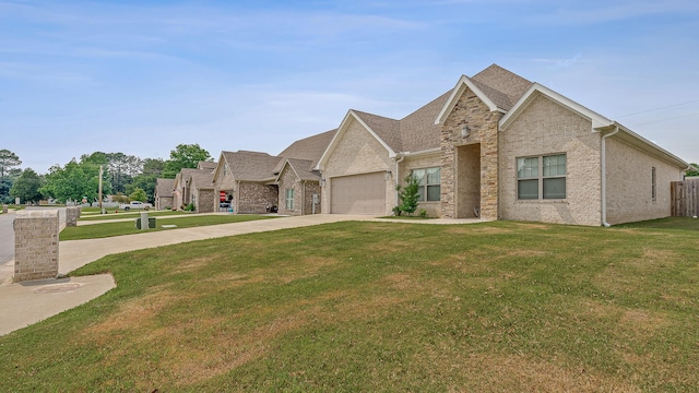 107 Hidden Creek Dr, Brookland, AR 72417 - view of front facade featuring driveway, an attached garage, a front yard, and brick siding