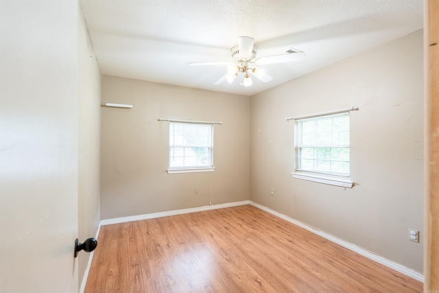 304 Main St, Letona, AR 72143 - unfurnished room featuring light wood-style flooring, a ceiling fan, and baseboards