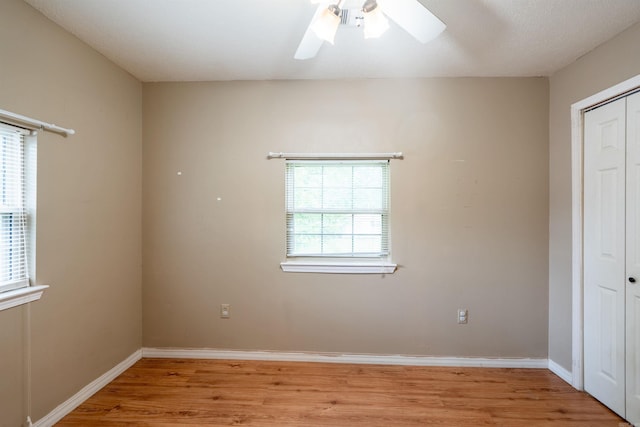 304 Main St, Letona, AR 72143 - unfurnished bedroom featuring light wood-style flooring, multiple windows, a closet, and baseboards