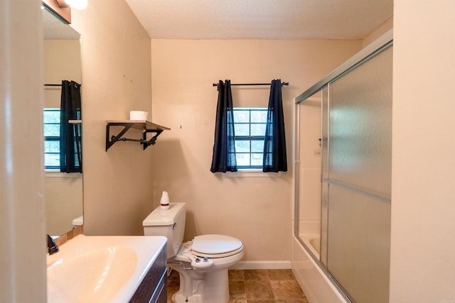 304 Main St, Letona, AR 72143 - full bathroom with healthy amount of natural light, toilet, a sink, and baseboards