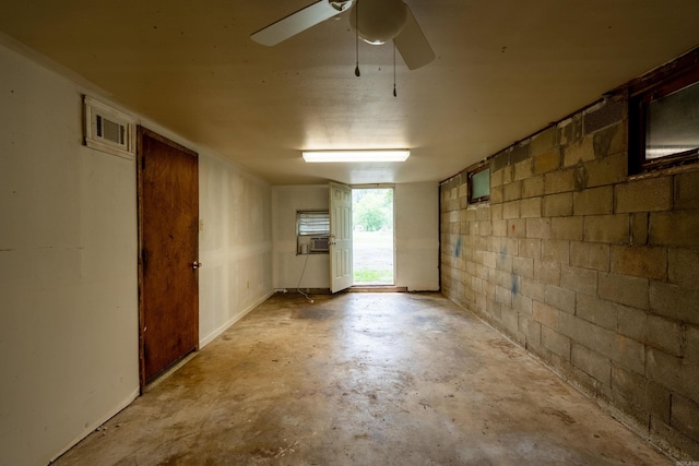 304 Main St, Letona, AR 72143 - spare room with unfinished concrete flooring, concrete block wall, a ceiling fan, and cooling unit
