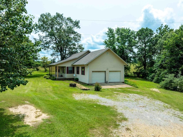 569 Hamlett Springs Rd, Cave City, AR 72521 - view of property exterior featuring a garage, driveway, a lawn, and roof with shingles