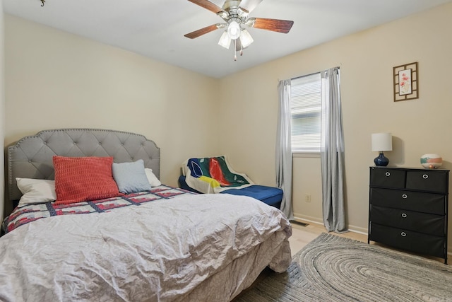 415 W 50th St, North Little Rock, AR 72118 - bedroom featuring baseboards, wood finished floors, and ceiling fan