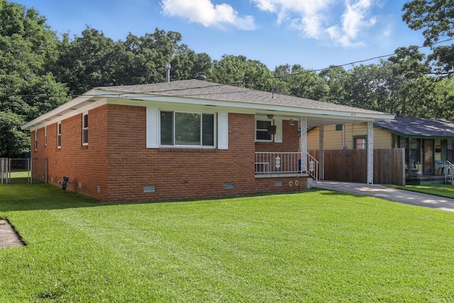 415 W 50th St, North Little Rock, AR 72118 - bungalow with crawl space, brick siding, driveway, covered porch, and a carport