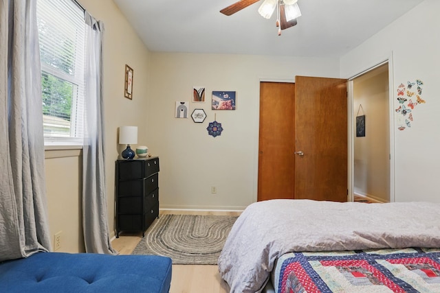 415 W 50th St, North Little Rock, AR 72118 - bedroom featuring light wood-type flooring, baseboards, and a ceiling fan