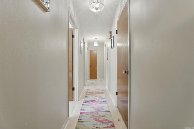 415 W 50th St, North Little Rock, AR 72118 - hall featuring a chandelier and baseboards