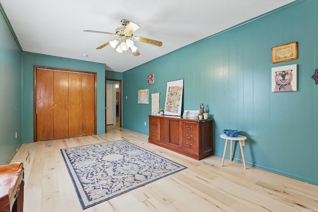 415 W 50th St, North Little Rock, AR 72118 - bedroom featuring wood finished floors, a closet, and ceiling fan