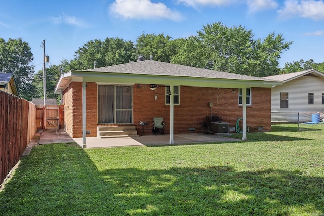 415 W 50th St, North Little Rock, AR 72118 - back of property with a gate, a patio area, entry steps, brick siding, and cooling unit