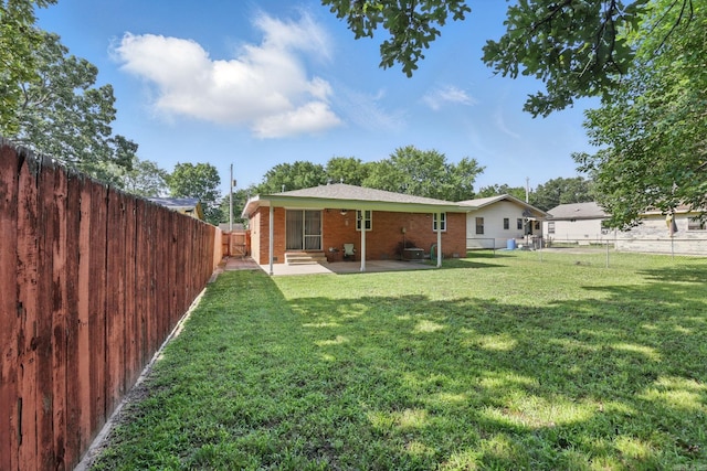 415 W 50th St, North Little Rock, AR 72118 - back of property featuring a patio area and brick siding