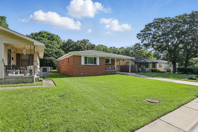415 W 50th St, North Little Rock, AR 72118 - view of front of house featuring covered porch, crawl space, a front lawn, and brick siding