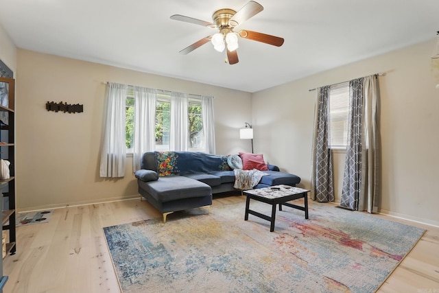 415 W 50th St, North Little Rock, AR 72118 - living area featuring a ceiling fan, wood finished floors, and baseboards